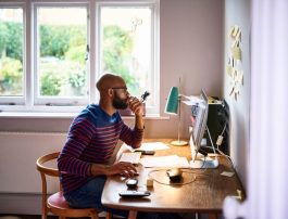 Man using computer in home office